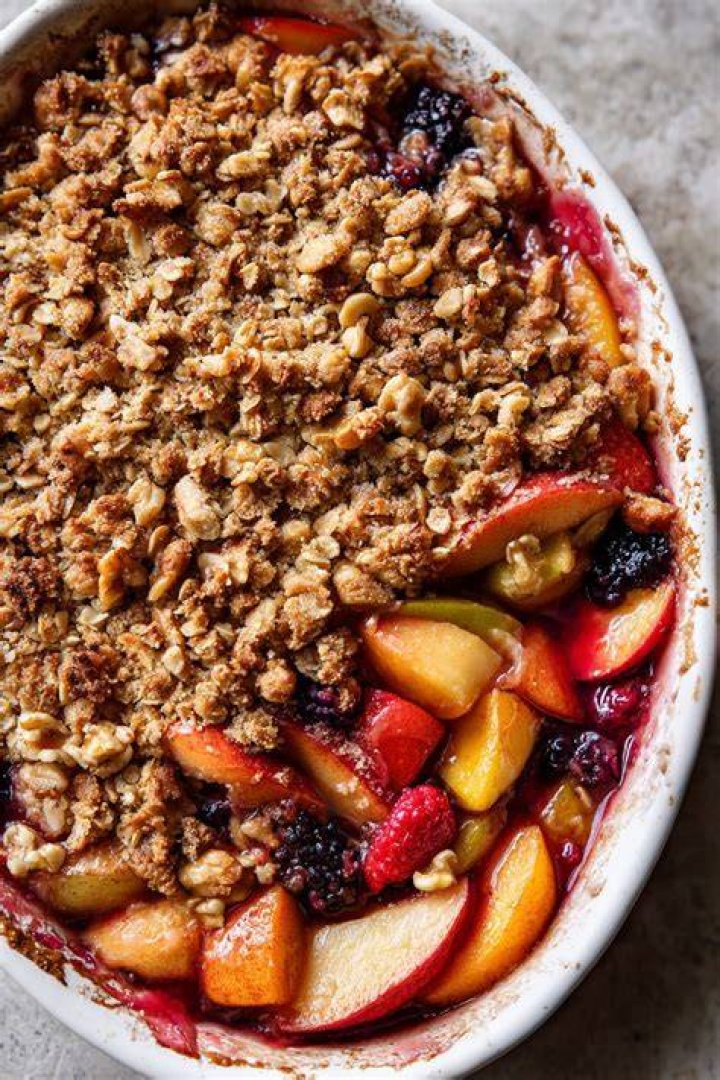 Fruit crisp in a clear pie plate.