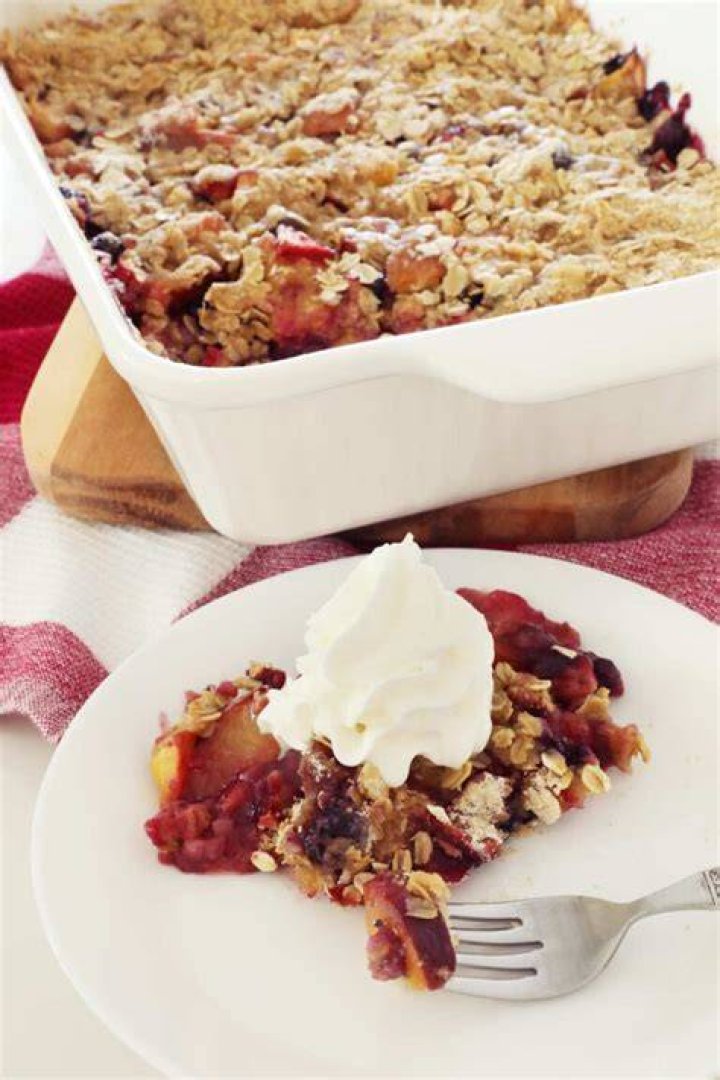 Fruit crisp in a white bowl. 