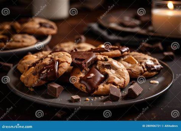 Plate of chocolate cookies topped with peanut butter chips