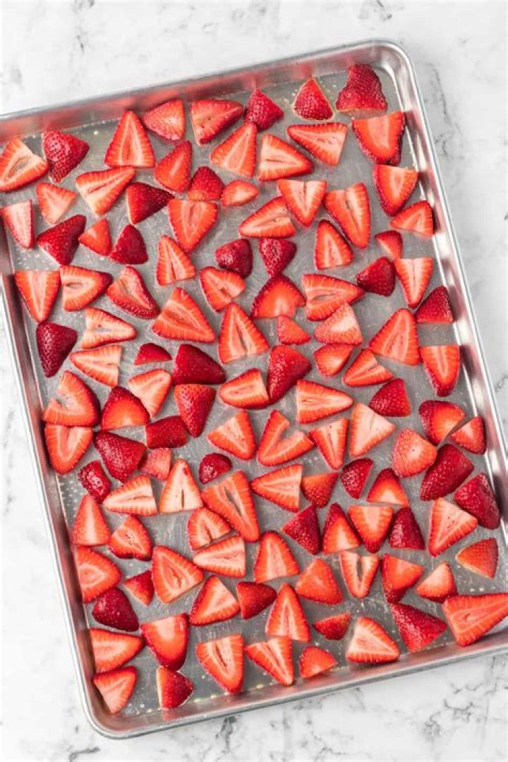 Roasted strawberries in a baking dish.