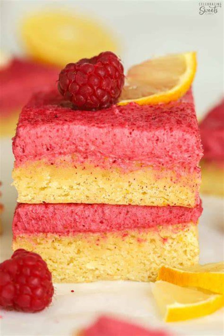 Two raspberry lemon bars stacked on top of each other.
